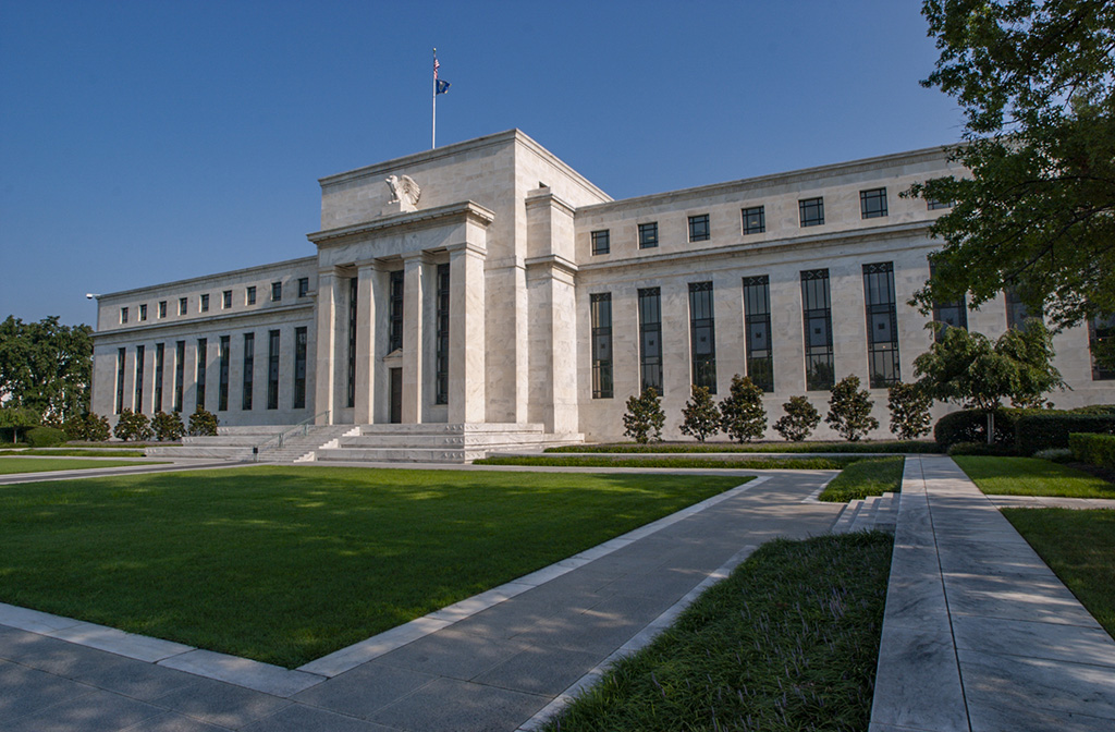 Federal Reserve headquarters building in Washington DC under clear blue sky