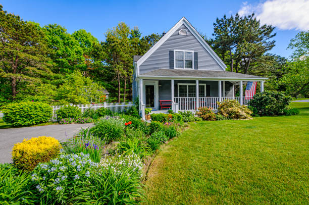 American suburban home with porch and garden in springtime