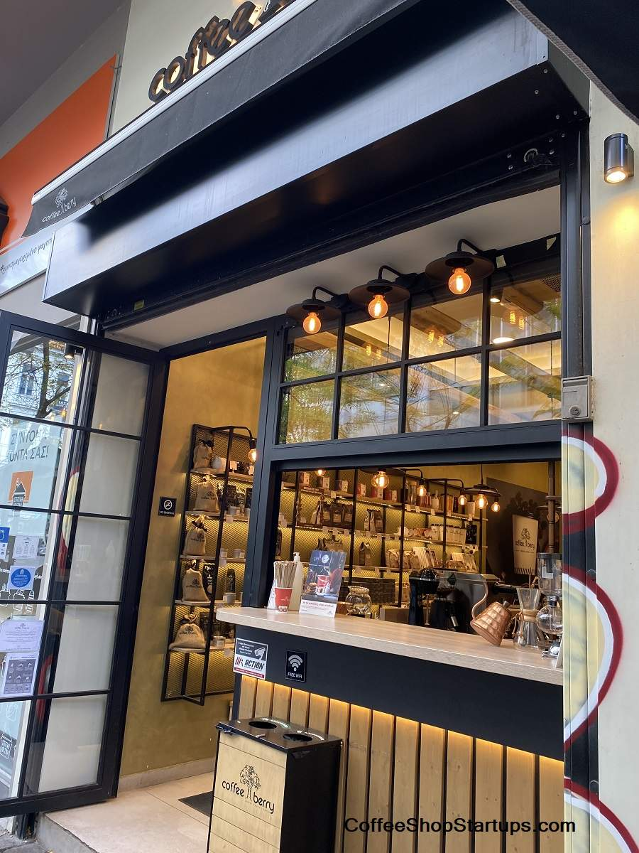 Cozy independent coffee shop storefront with warm lighting